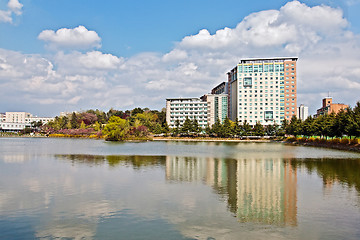 Image showing Modern apartment buildings over lake in a university campus