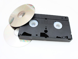 Image showing DVD disks and VHS video the cartridge