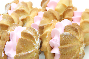 Image showing Yellow cookies with a  stuffing  on a white background 