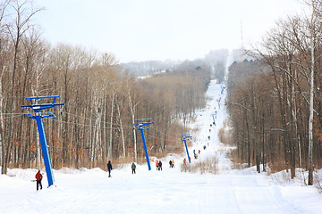 Image showing Skiers go on the lift on mountain in Primorski Territory Russia