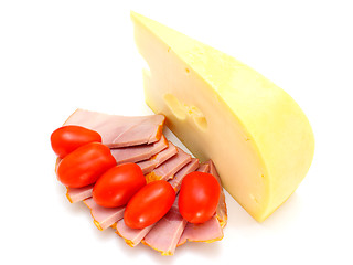 Image showing Cheese with holes and red tomatoes 