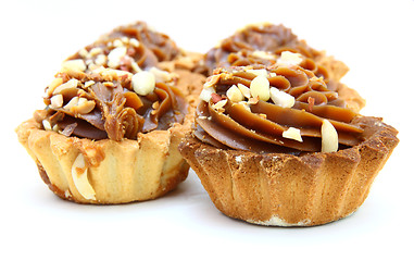 Image showing Pie a basket with chocolate condensed milk and nuts 