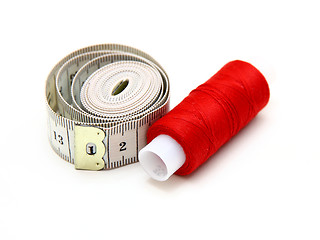 Image showing The coil of a red thread with centimeter 