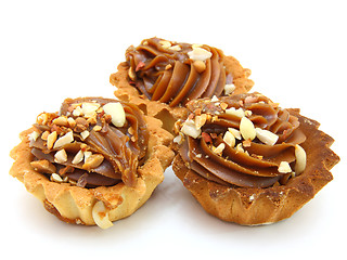 Image showing Pie a basket with chocolate condensed milk and nuts 