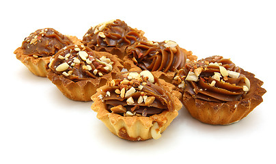 Image showing Pie a basket with chocolate condensed milk and nuts 