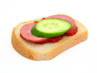 Image showing sandwich with Ketchup sausage and a cucumber 