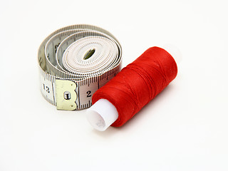 Image showing The coil of a red thread with centimeter 