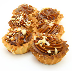 Image showing Pie a basket with chocolate condensed milk and nuts 