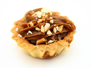 Image showing Pie a basket with chocolate condensed milk and nuts
