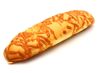 Image showing The ruddy long loaf of bread is strewed by cheese