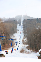 Image showing Skiers go on the lift on mountain in Primorski Territory Russia