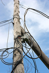 Image showing wooden pole with wires