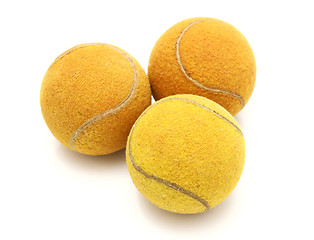 Image showing Three old tennis balls on a white background