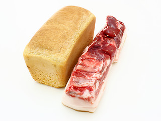 Image showing Roll of fresh bread and the big piece 