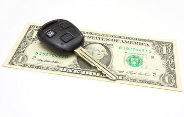 Image showing The car key lies on a dollar 