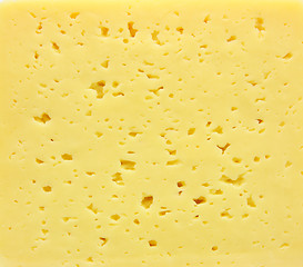 Image showing Background of fresh yellow Swiss cheese with holes