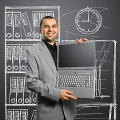 Image showing businessman with open laptop in his hands