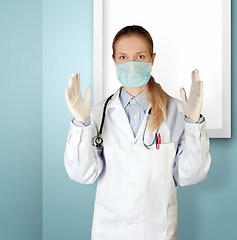 Image showing doctor woman in mask looking at camera