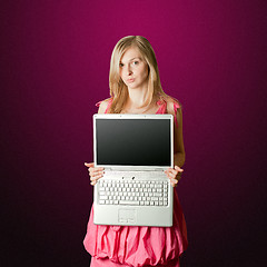 Image showing femaile in pink with open laptop