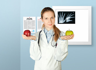 Image showing female doctor with two apples