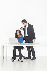 Image showing boy in office clothes ponting a gun to a girl 