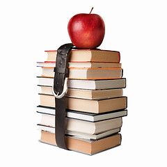 Image showing books pile with belt and apple