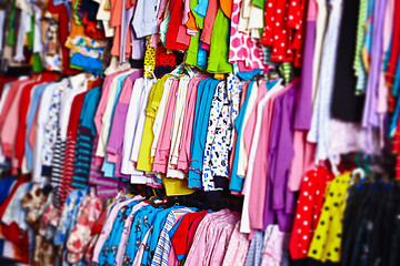 Image showing Baby clothes hangers in a store