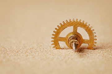 Image showing Clock detail - a gear in the sand