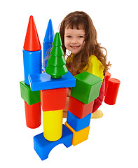 Image showing Child built a castle from color cubes