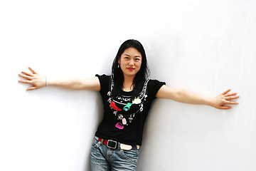 Image showing Portrait of a Korean woman in jeans and a t-shirt