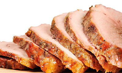 Image showing Roast pork on a wooden board