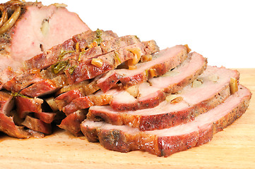 Image showing Roast pork on a wooden board