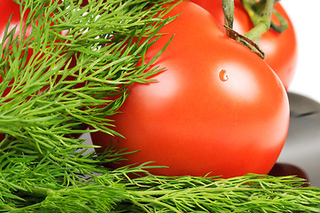 Image showing Tomatoes on a black plate