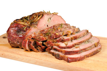 Image showing Roast pork on a wooden board