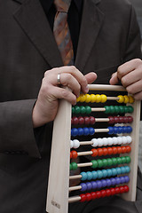 Image showing Businessman with abacus