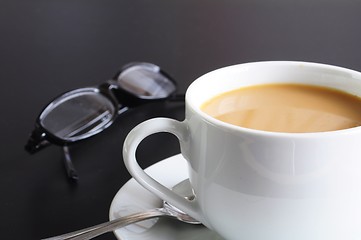 Image showing cup of coffee in the office