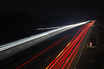 Image showing road with car traffic at night with blurry lights