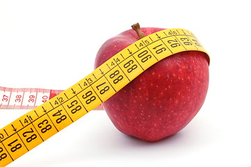 Image showing Apple and measuring tape on white