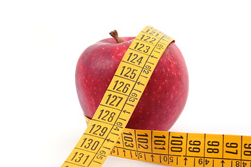 Image showing Apple and measuring tape on white