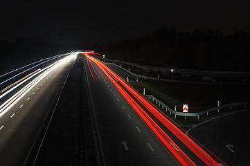 Image showing road with car traffic at night with blurry lights