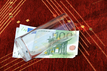 Image showing Empty Glass on Euro Banknotes