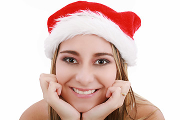 Image showing Picture of pretty christmas girl in santa hat, smiling isolated 
