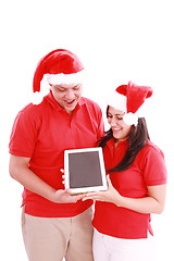 Image showing Couple enjoying their new touchpad on christmas