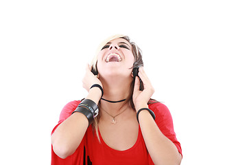 Image showing Young woman with a cool rocker style listening to music 