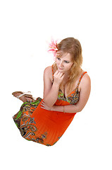 Image showing Pretty girl sitting on floor.