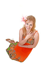 Image showing Lovely teen girl sitting on floor.