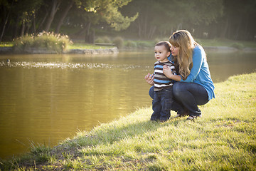 Image showing Happy Mother and Baby Son Looking Out At Lake