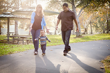 Image showing Happy Mixed Race Ethnic Family Walking In The Park