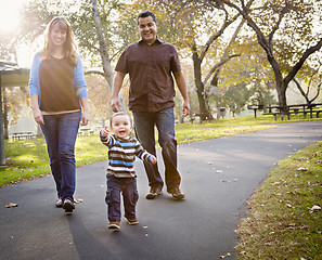 Image showing Happy Mixed Race Ethnic Family Walking In The Park