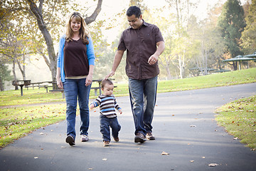 Image showing Happy Mixed Race Ethnic Family Walking In The Park